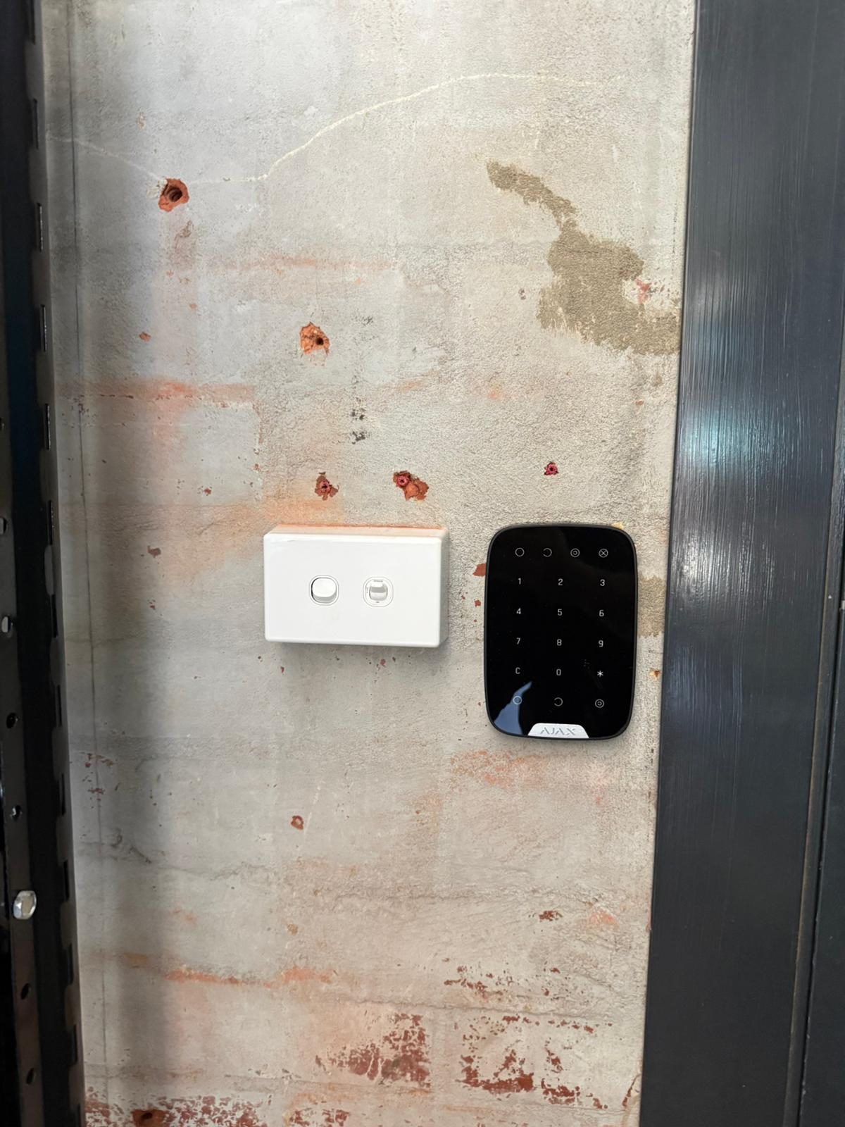 Indoor AJAX motion detector installed in a modern home