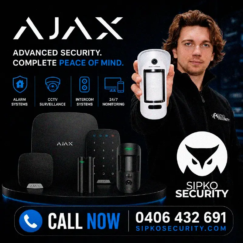 Professional alarm installation showing control panel setup and sensor placement