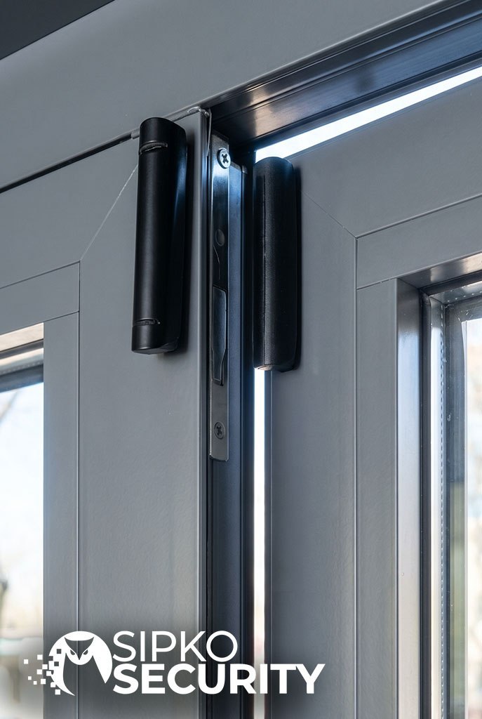 Ajax motion detector installed in corner of room