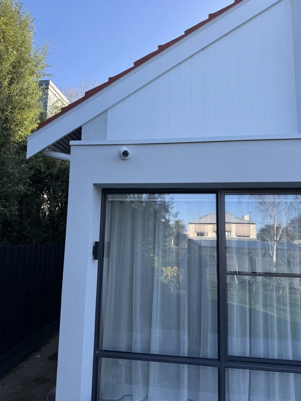 Outdoor security camera installed for residential exterior surveillance