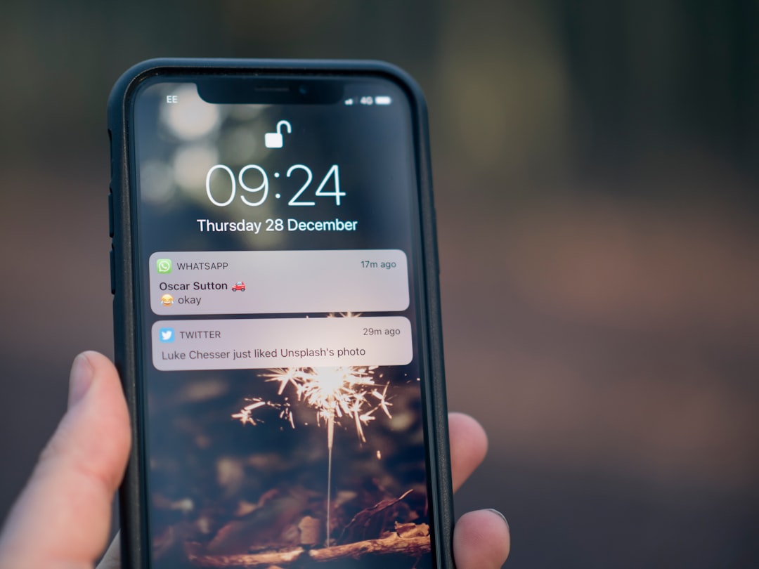 battery-solar-security-cameras-renters-phone-app - SIPKO Security Checking wireless security camera footage from a phone app