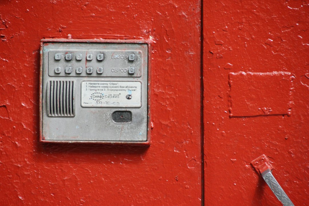 Close-up of an alarm keypad mounted on an interior wall