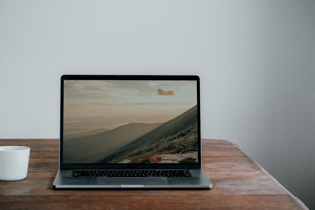 Laptop set up on a desk ready for iVMS-4200 configuration