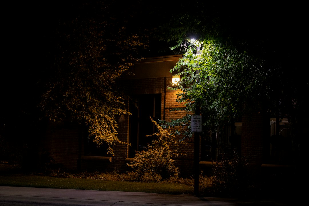 new-home-security-checklist-exterior-lighting - SIPKO Security A house exterior lit up at night by security lighting near the entry