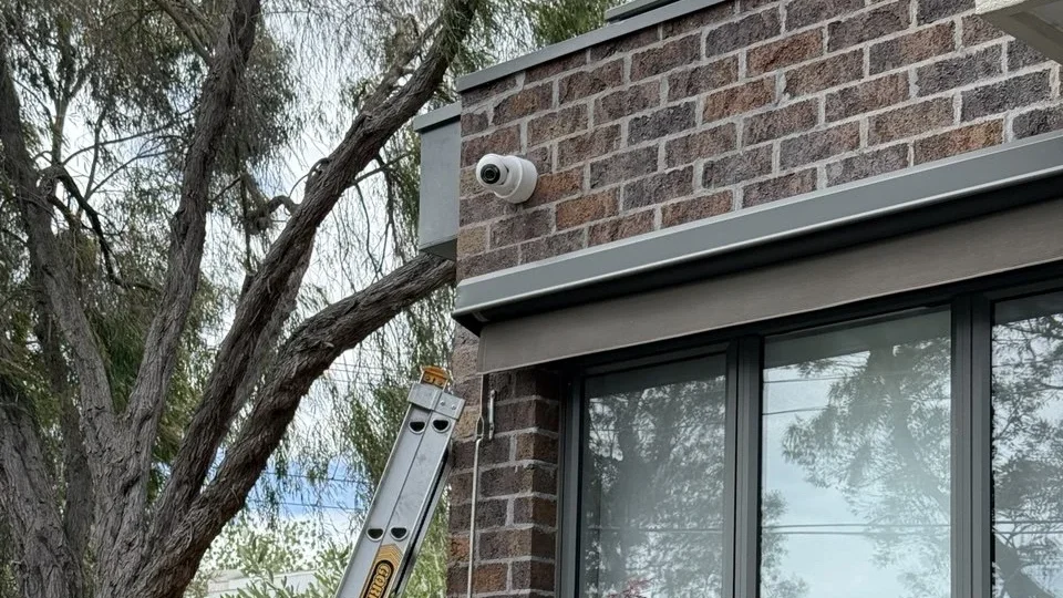 CCTV camera under eaves with ladder in place - SIPKO Security CCTV camera installed under the eaves of a Melbourne home with the install ladder still in place