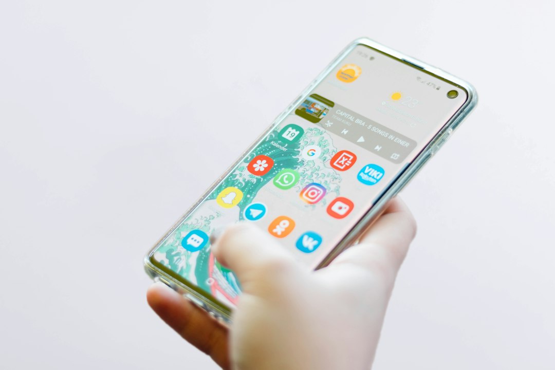 upgrade-or-replace-hardwired-alarm-app-control - SIPKO Security Smartphone in hand, representing app control added to a home alarm system