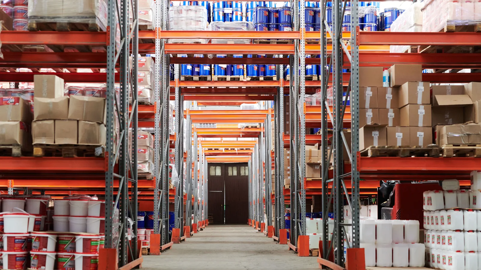 Warehouse aisle and stock coverage planning - SIPKO Security Warehouse aisle between tall racks of boxes and palletised goods