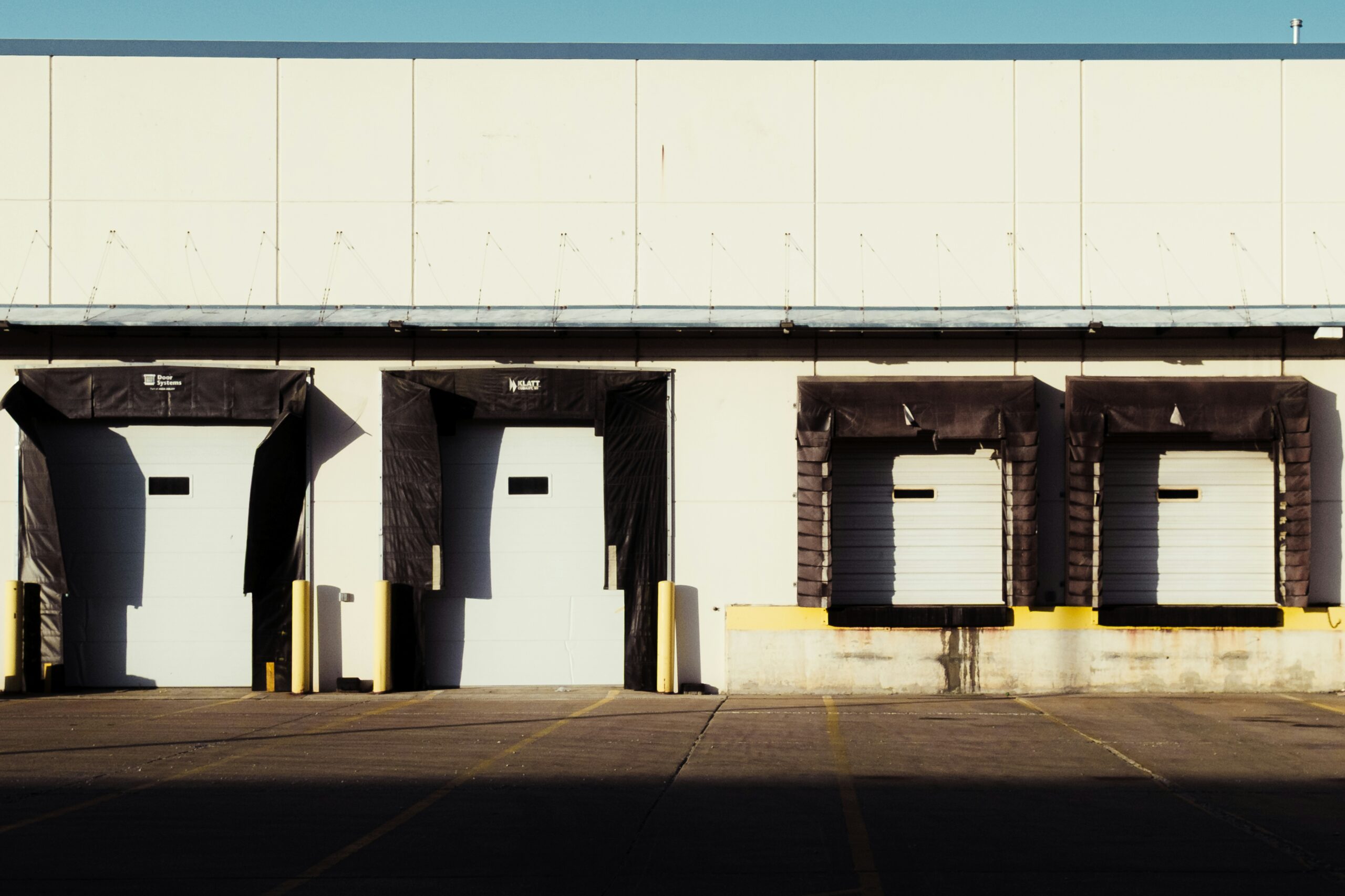 Commercial loading docks at dusk - SIPKO Security A row of commercial loading docks at dusk