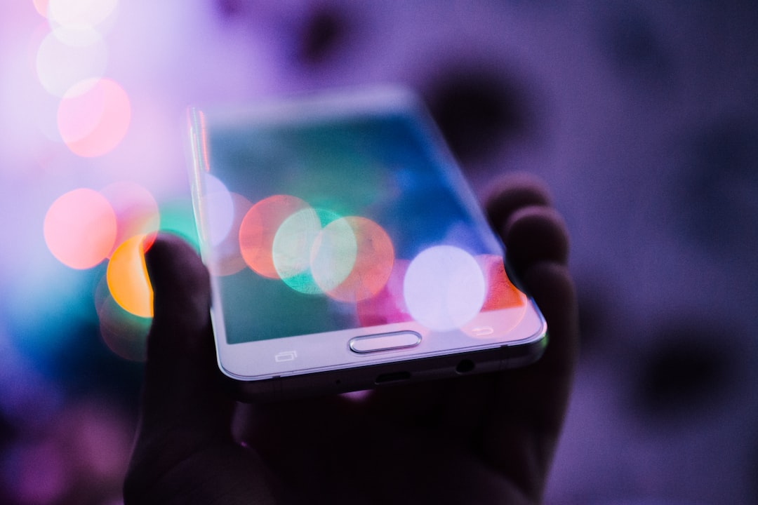 home alarm without wifi or internet - smartphone - SIPKO Security Person holding a smartphone to check a home alarm that works without Wi-Fi or internet