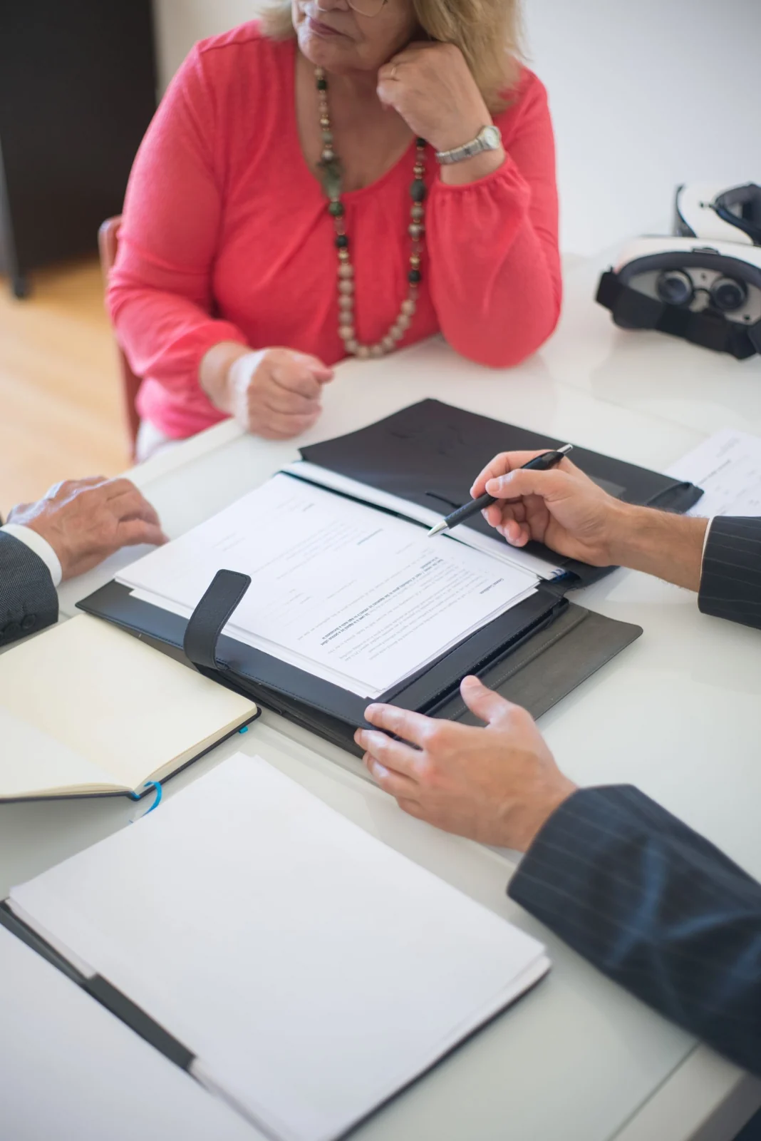 Installer guide - supporting photo 1 - SIPKO Security People reviewing paperwork around a table
