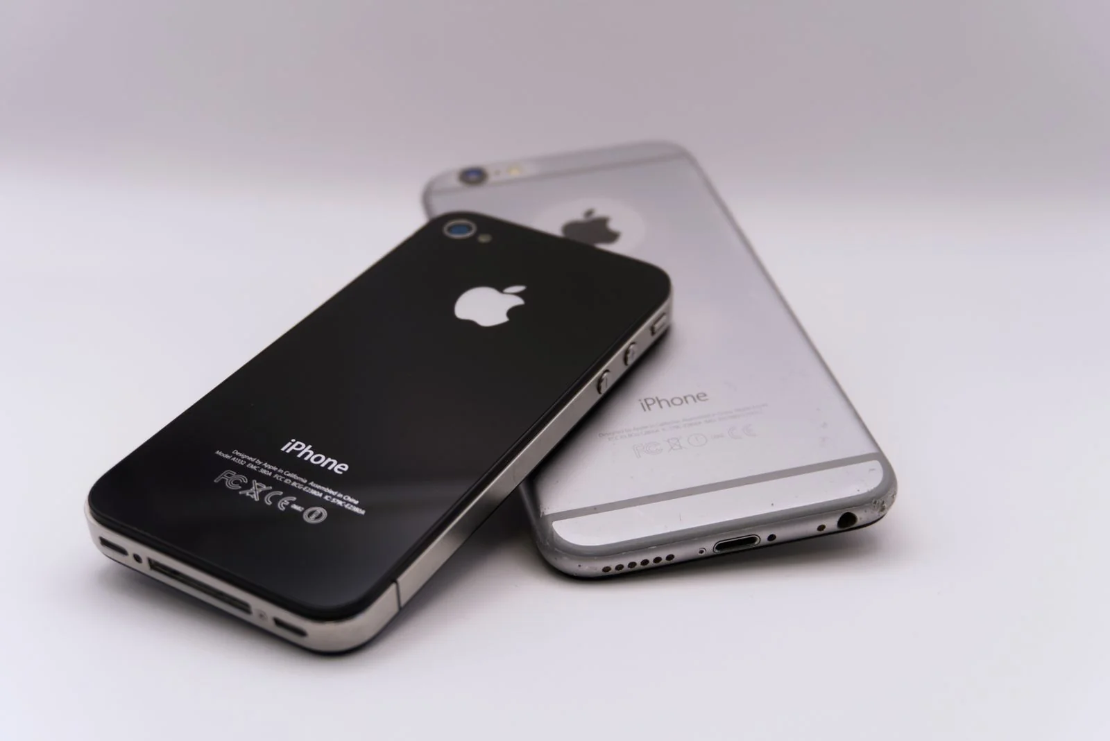 Two smartphones on a white surface - SIPKO Security Two smartphones on a white surface, the old phone to be erased only after the new one passes every check