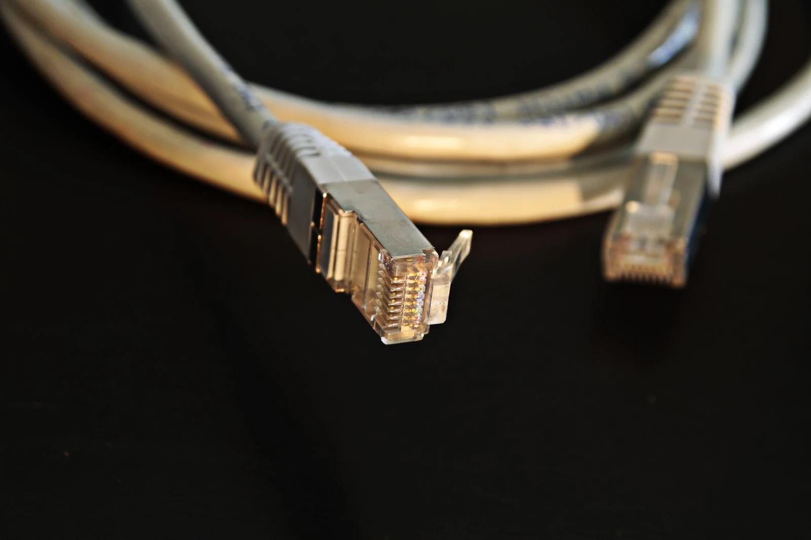 Ethernet cable connectors shown close up - SIPKO Security Ethernet cable connectors shown close up