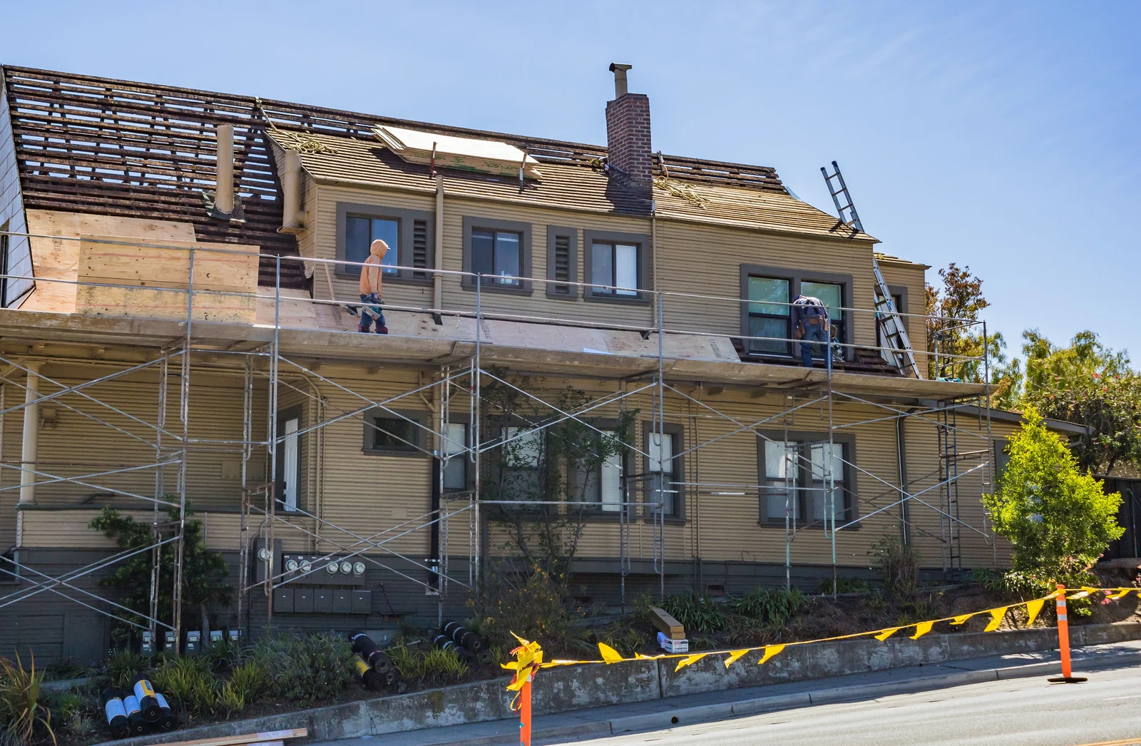 Scaffolding around house renovation - SIPKO Security Scaffolding around a two-storey house during roof renovation